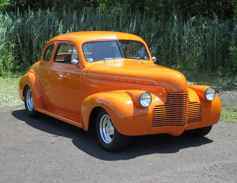 orange badass 1940 Chevrolet 5 Window Coupe hot rod