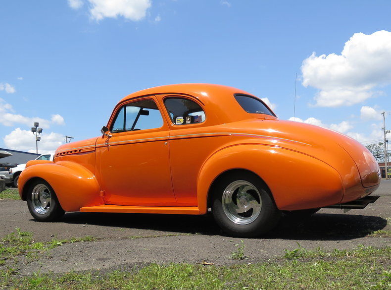 orange badass 1940 Chevrolet 5 Window Coupe hot rod