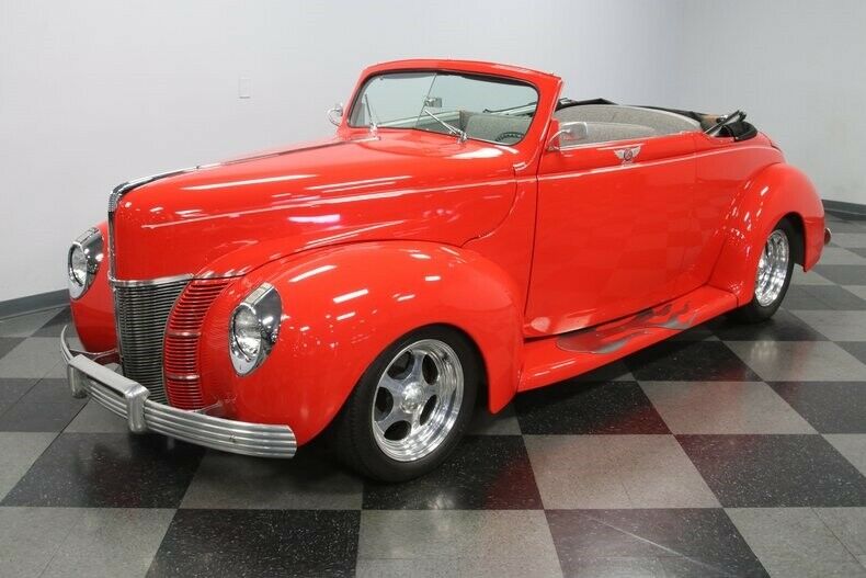 shiny 1940 Ford Deluxe Convertible Coupe hot rod